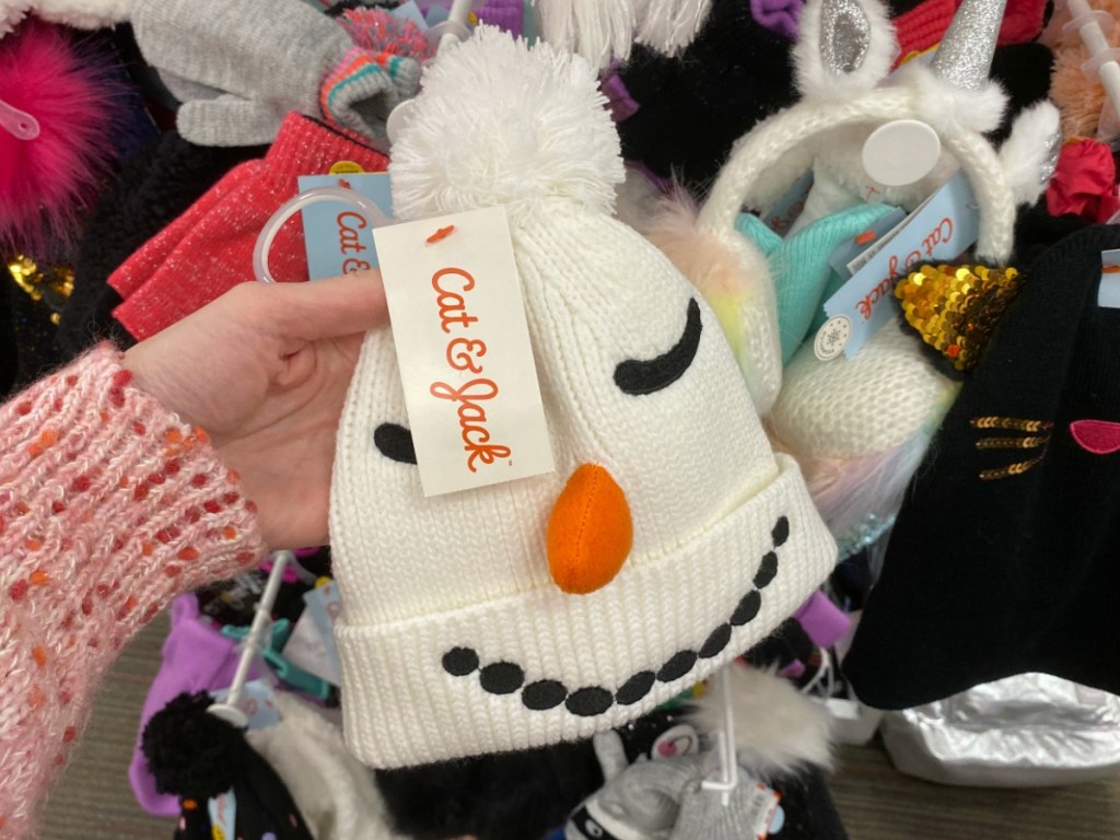 Snowman beanie hat in hand at Target