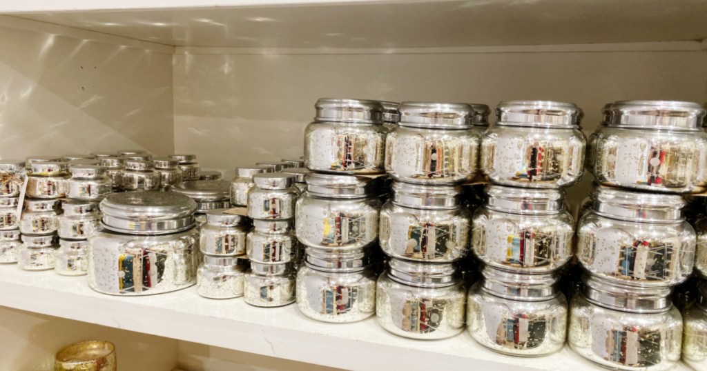 shelf of Capri Blue Volcano Iridescent Jar Candle with lids