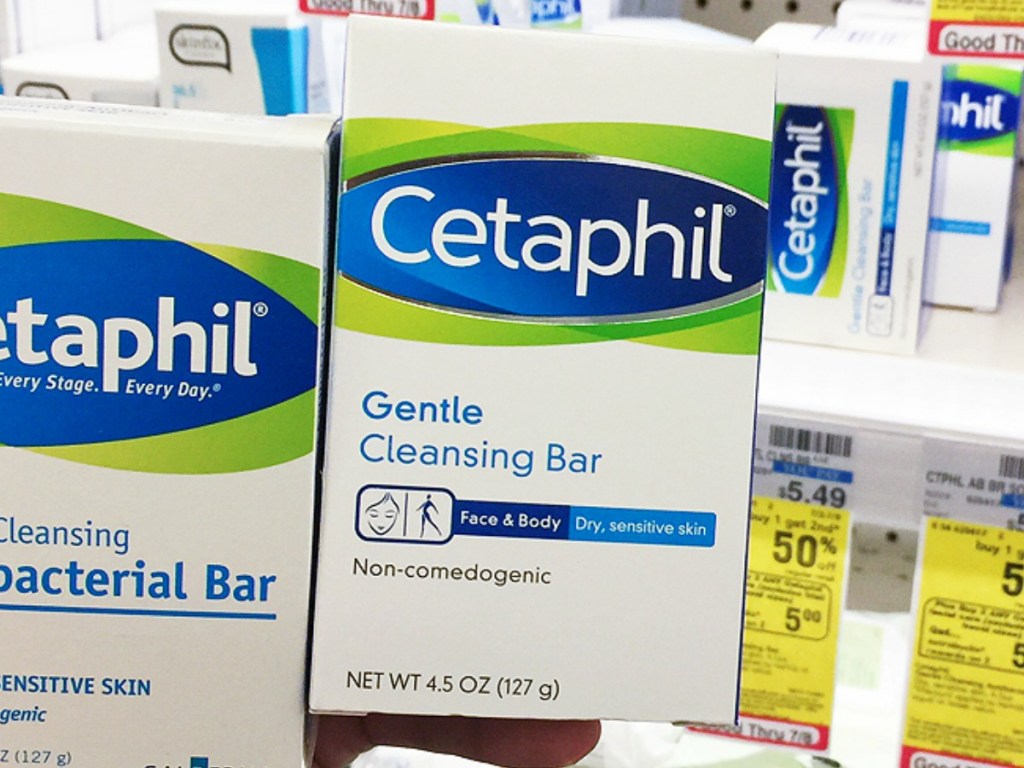 Cetaphil Gentle Cleansing Bar in hand in package near in-store display
