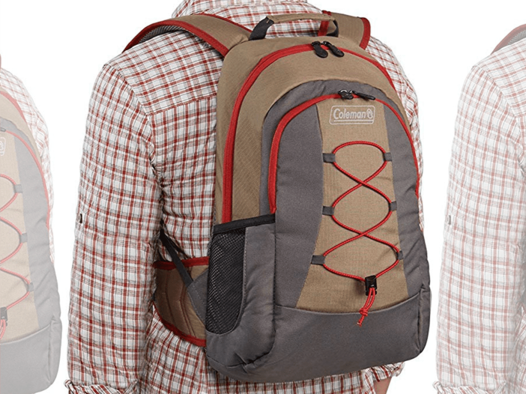 Man in flannel shirt wearing a Coleman Cooler Backpack
