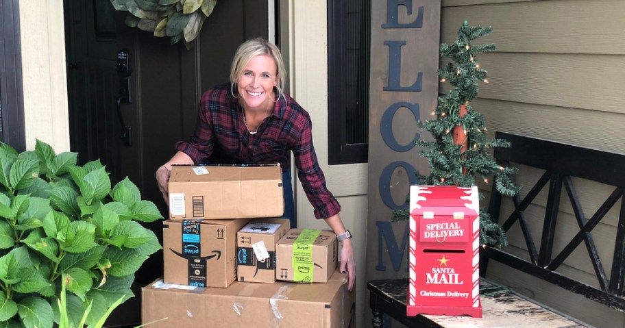 woman with Amazon boxes on porch which arrived before the christmas shipping deadlines