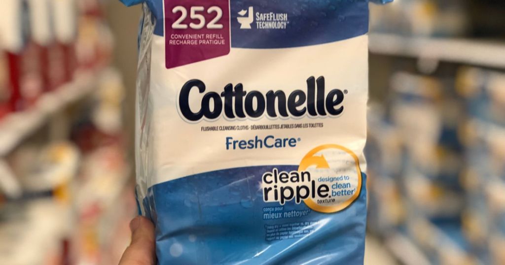 hand holding Cottonelle FreshCare 252 Count in store