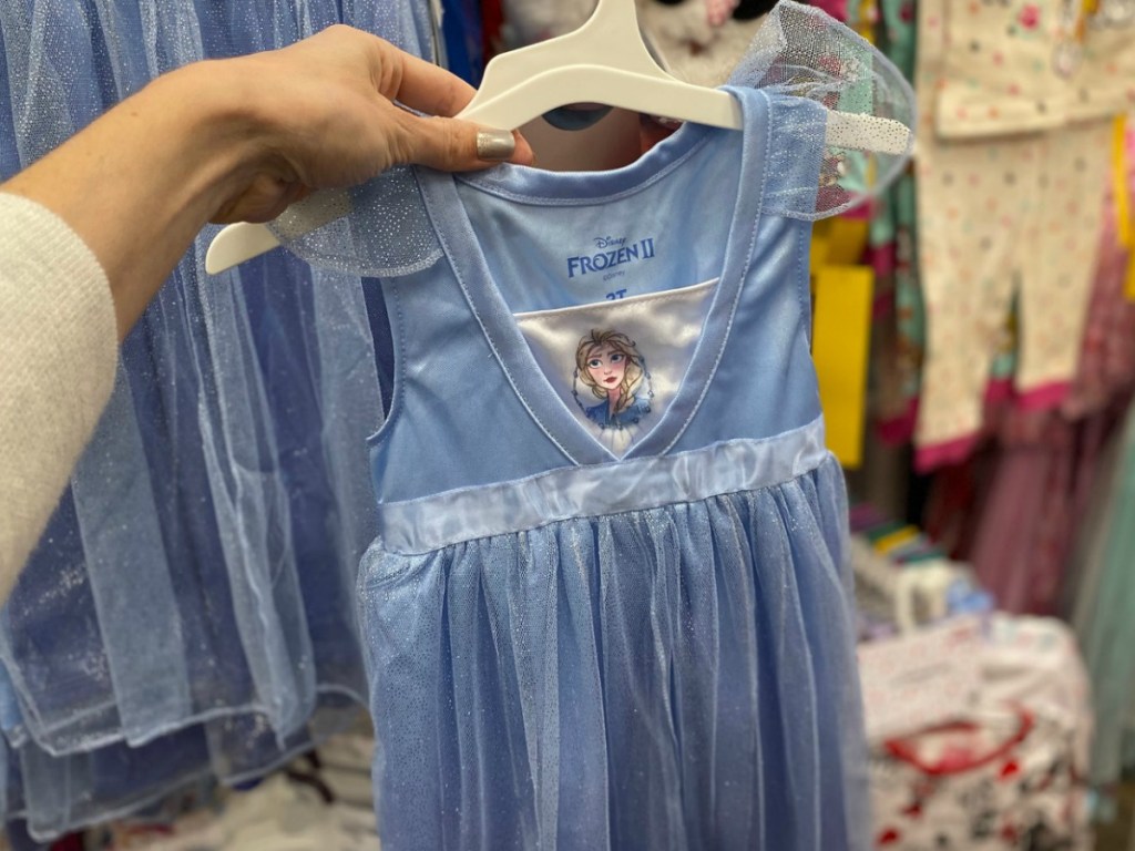 Disney Frozen themed nightgown on hanger in hand at Target