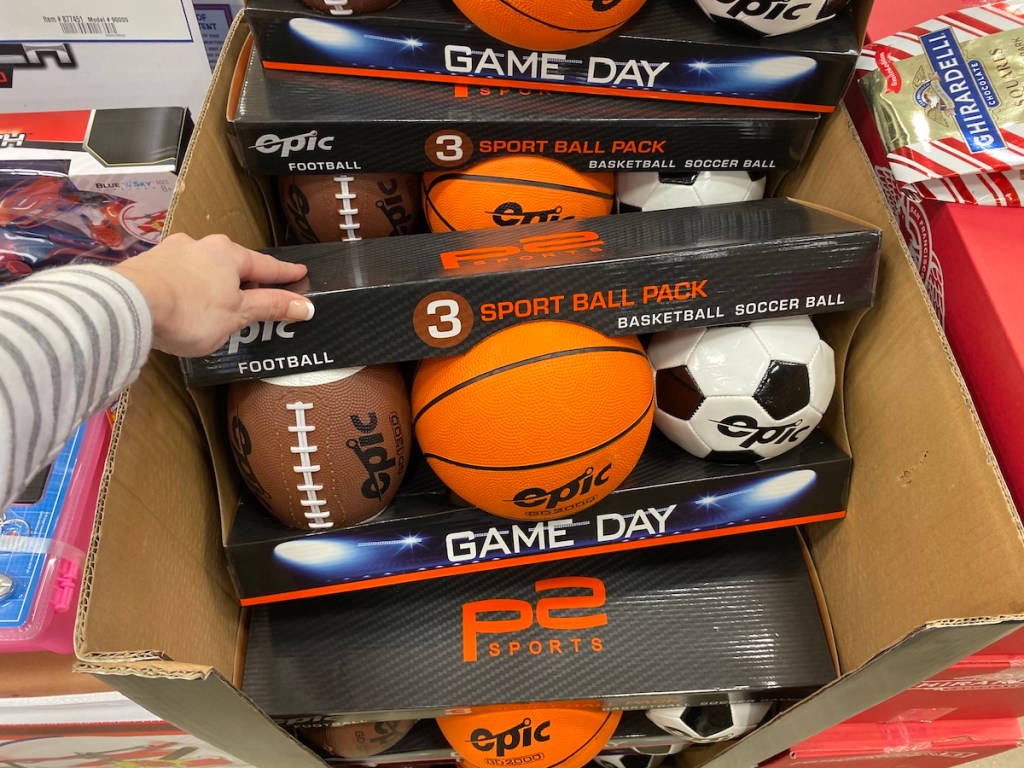 hand holding pack of Epic Games Sports Balls