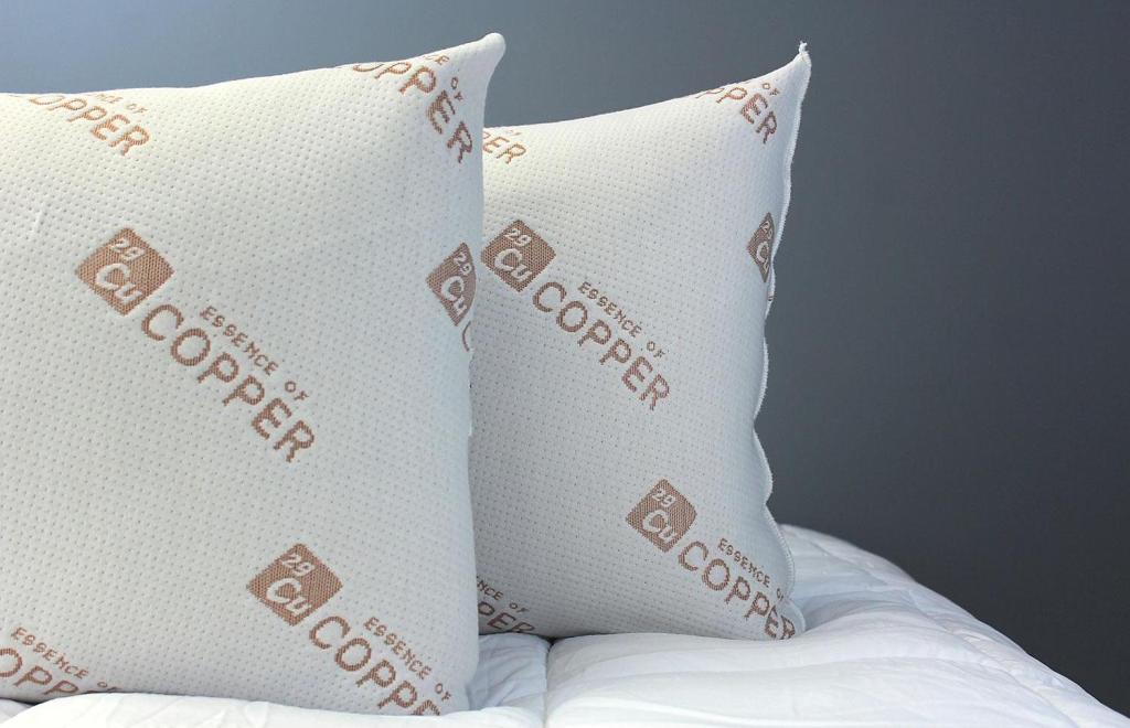 Essence of Copper Bed Pillows on bed