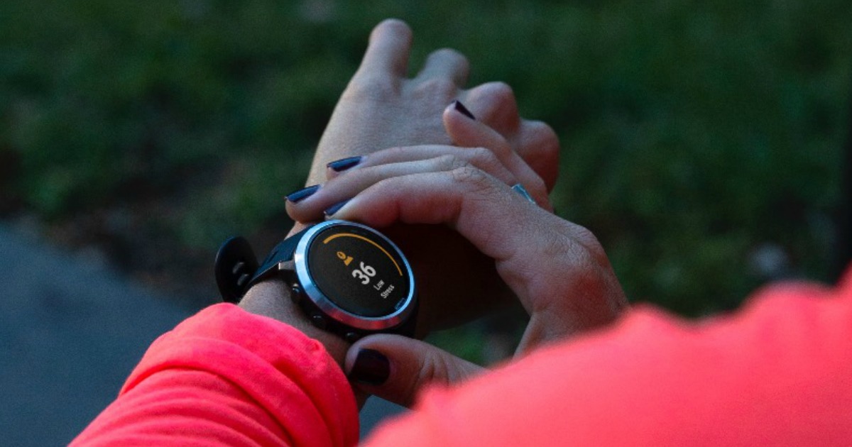 woman looking at her Garmin Vivoactive