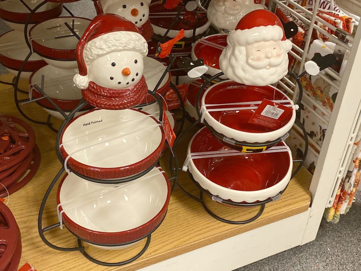 Snowman and Santa Claus themed serving trays on display at Kohl's