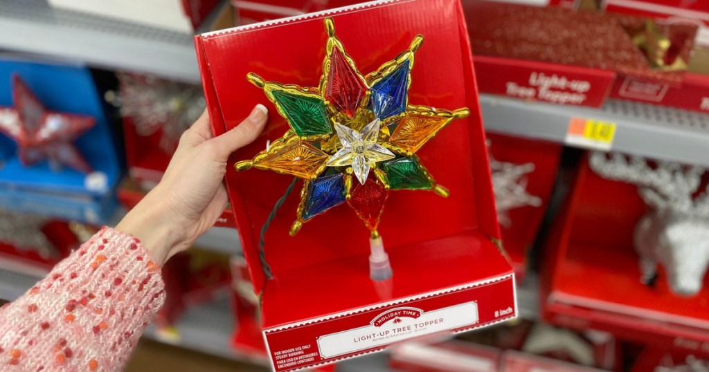hand holding star tree topper