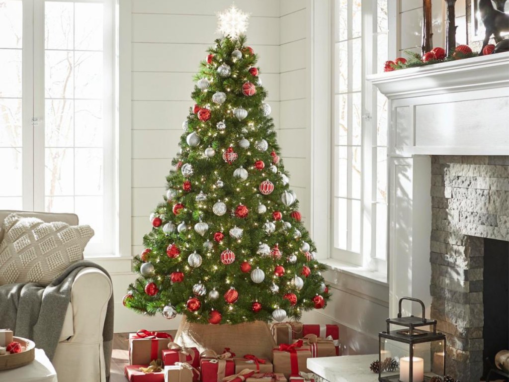 fully decorated christmas tree with gifts under the tree