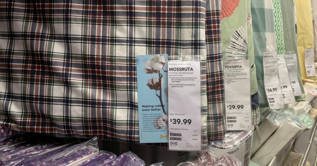 IKEA duvet covers hanging with price tags 