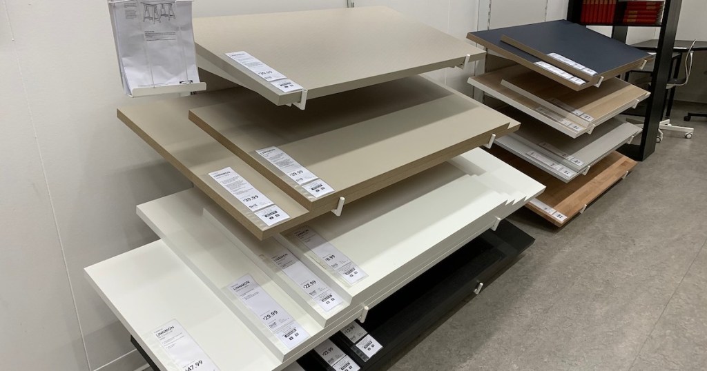 various sizes of IKEA tabletops hanging on store shelves