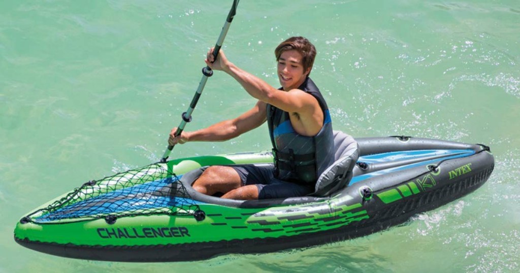 man rowing a kayak