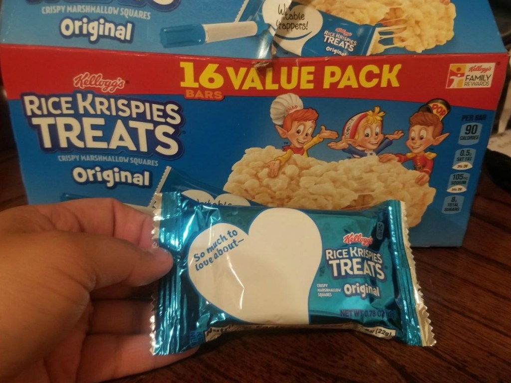 Woman holding Kellogg’s Rice Krispies Treats Value Pack