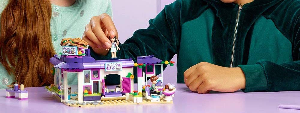 girls playing with LEGO Friends Emma’s Art Café Building Set
