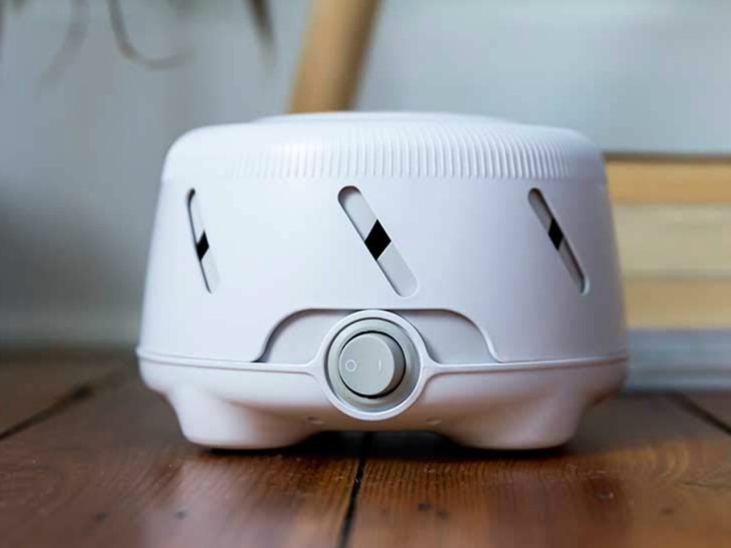 Marpac brand white noise machine in white on the floor