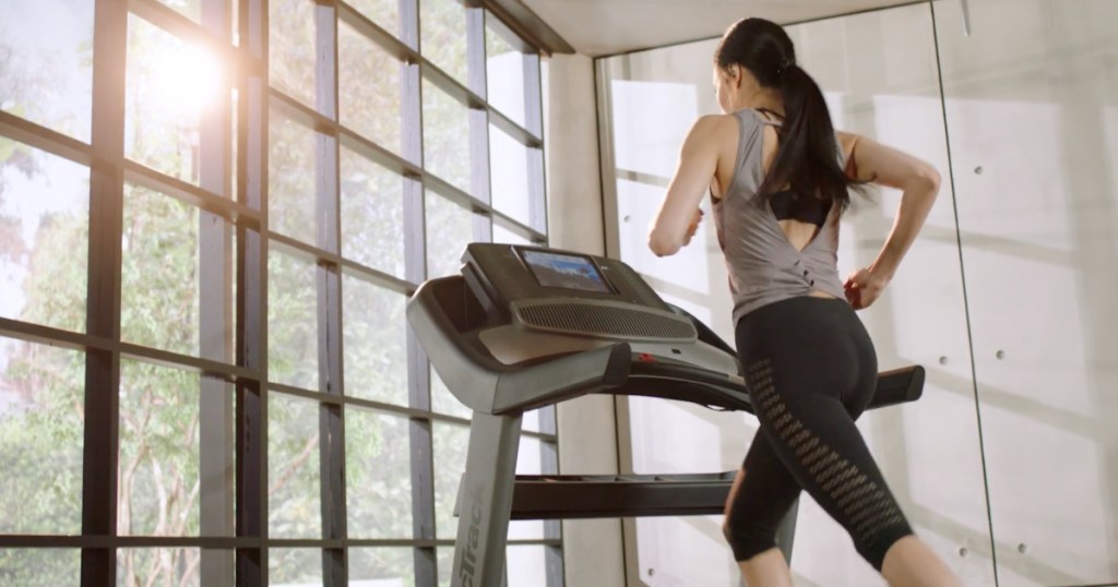 woman running inside on NordicTrack Treadmill 1750