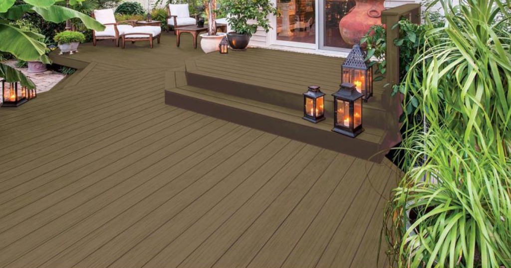 stained deck with greenery and patio furniture