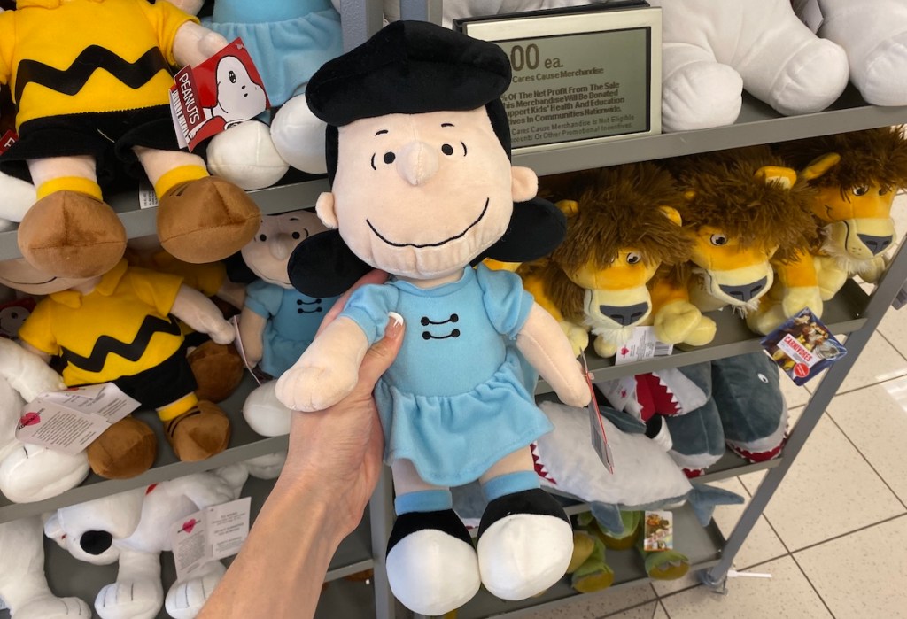hand holding a Peanuts Lucy Plush