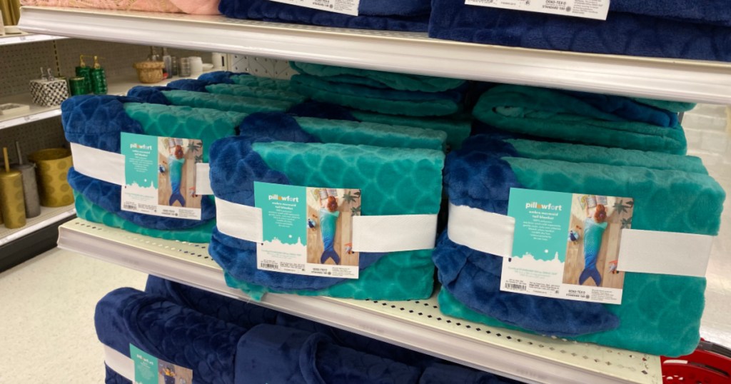 shelf with Pillowfort Blue Ombre Mermaid Tail Blanket