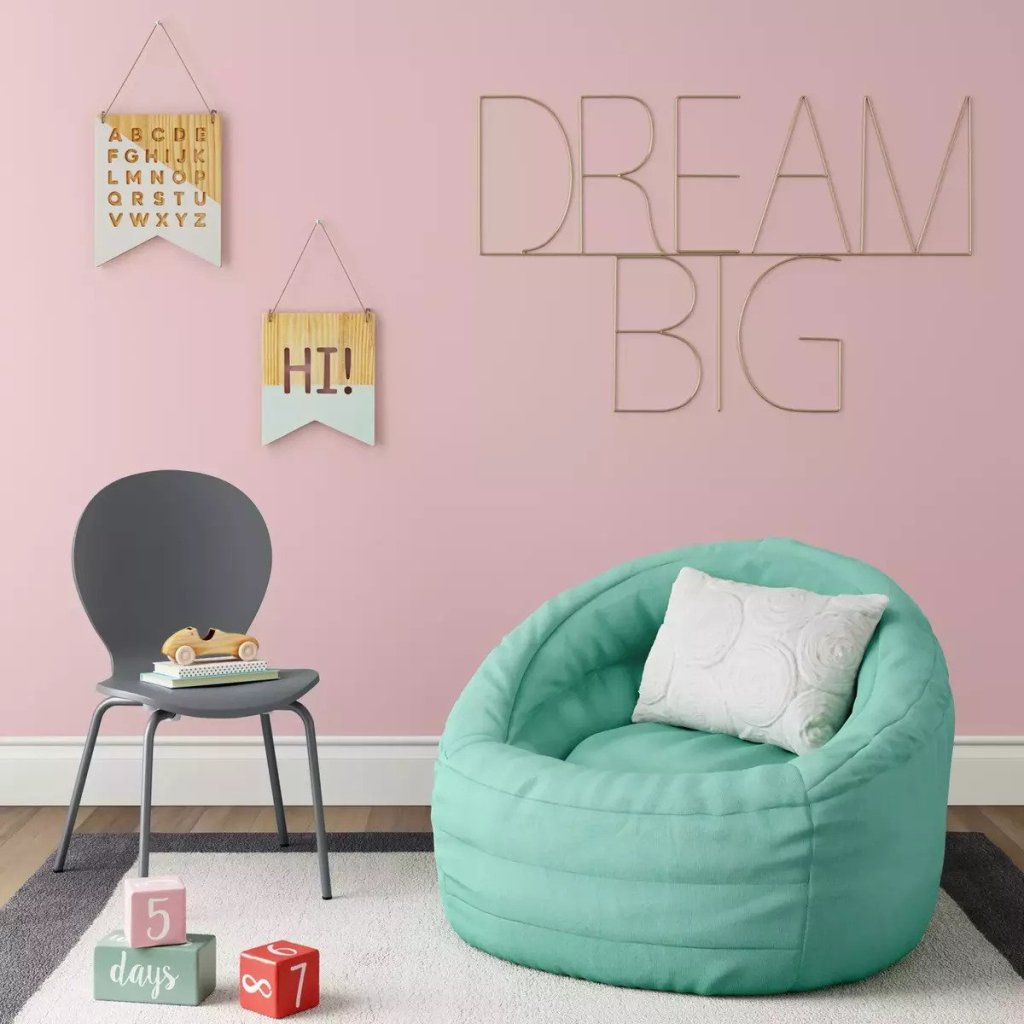 teal Pillowfort Cocoon Bean Bag Chair With Pocket in room with pink wall, dream big sign