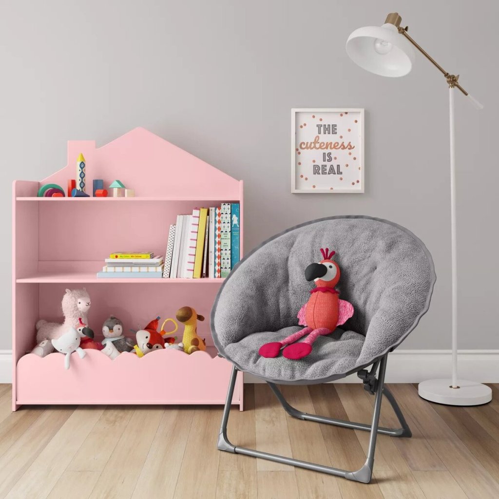 Pillowfort Fuzzy Kids Saucer Chair in bedroom with pink bookcase