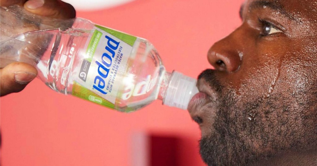 Man drinking Propel Kiwi Strawberry Water