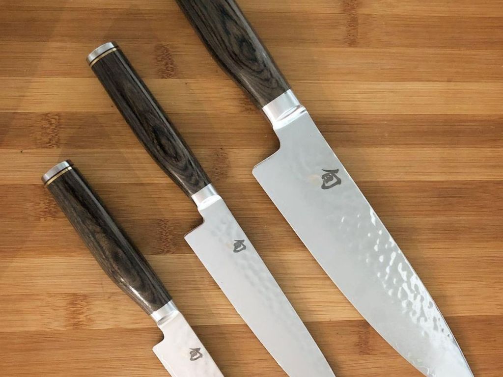 assorted size Shun Premier Chef's Knifes on cutting board