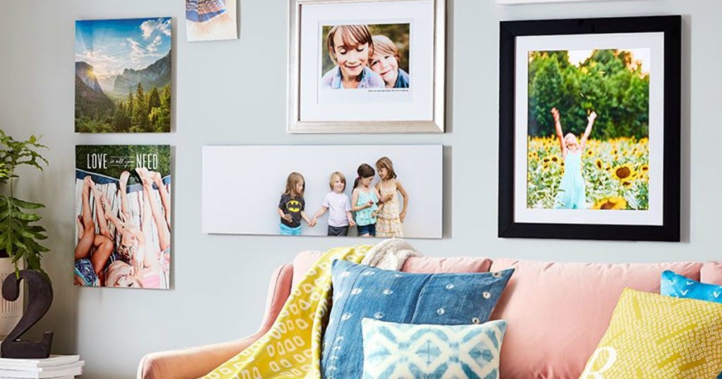 living room with Shutterfly photos on wall by couch