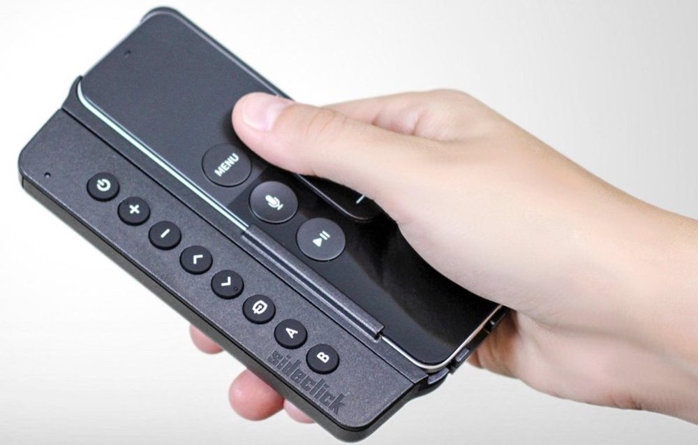 hand holding the Sideclick for Apple TV remote