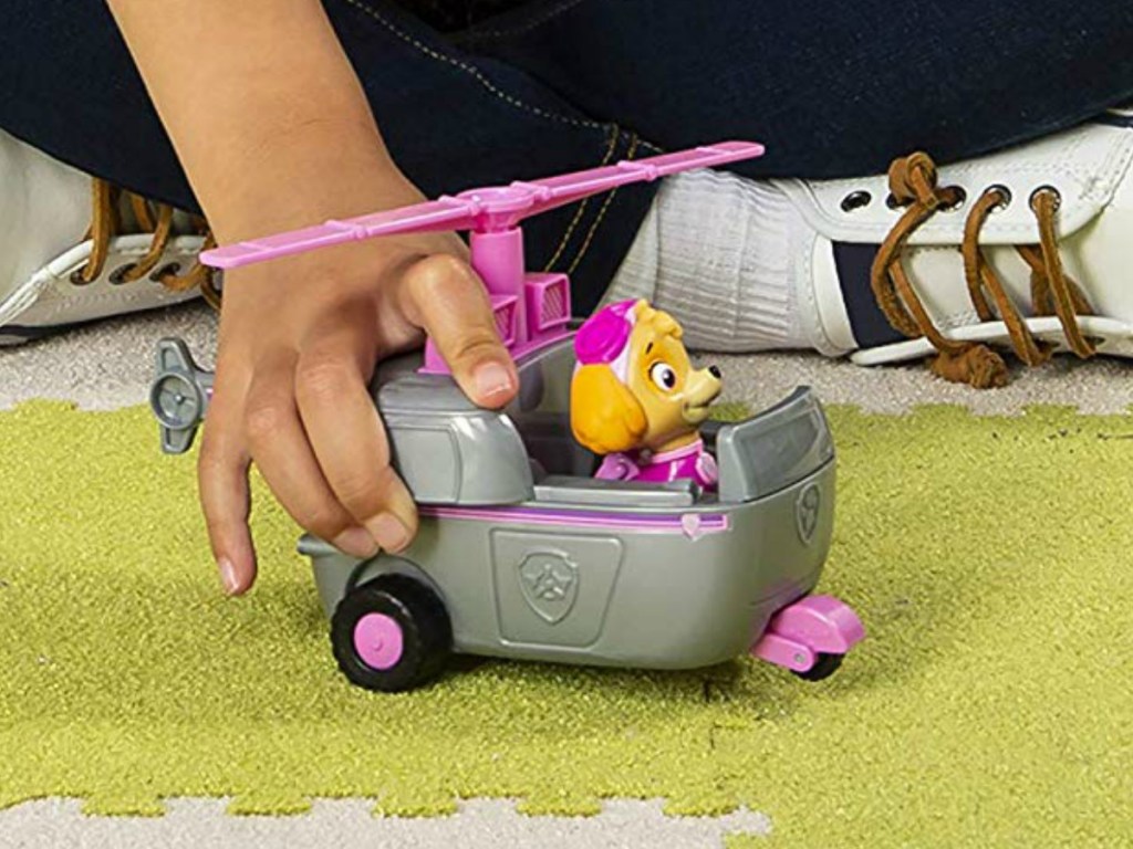 Young girl playing with a Paw Patrol Sky Playset