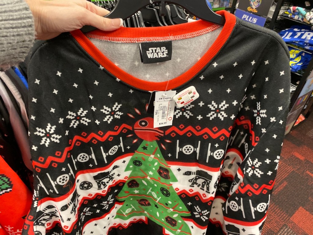 hand holding Star Wars Ugly Sweaters