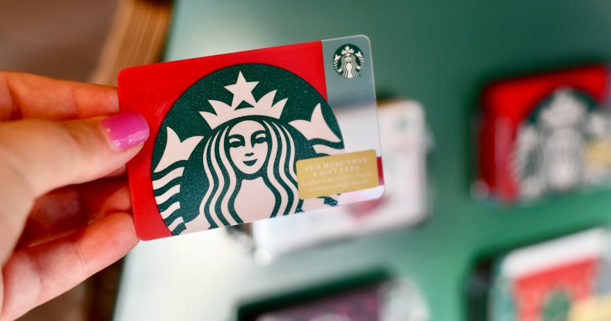 Woman holding Starbucks Gift Card