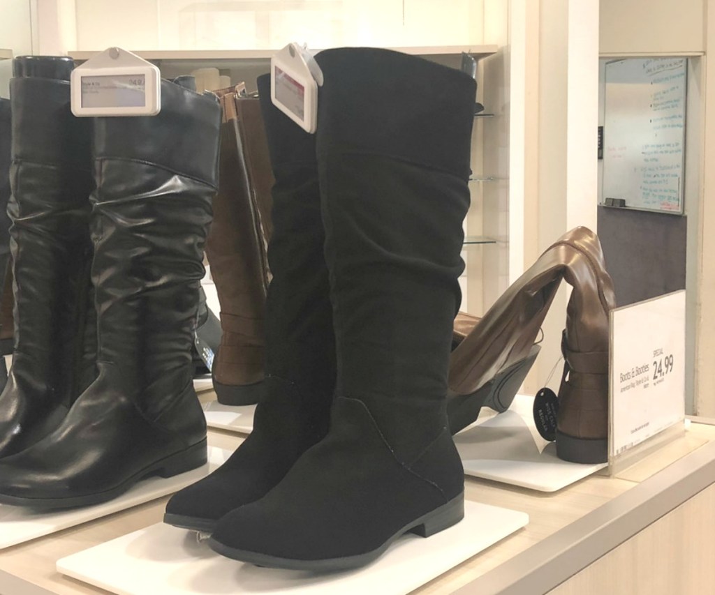 Women's black boots on display at Macy's
