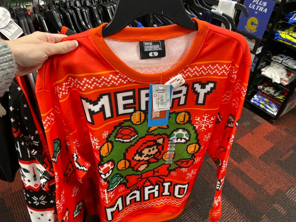hand holding Super Mario Ugly Sweater