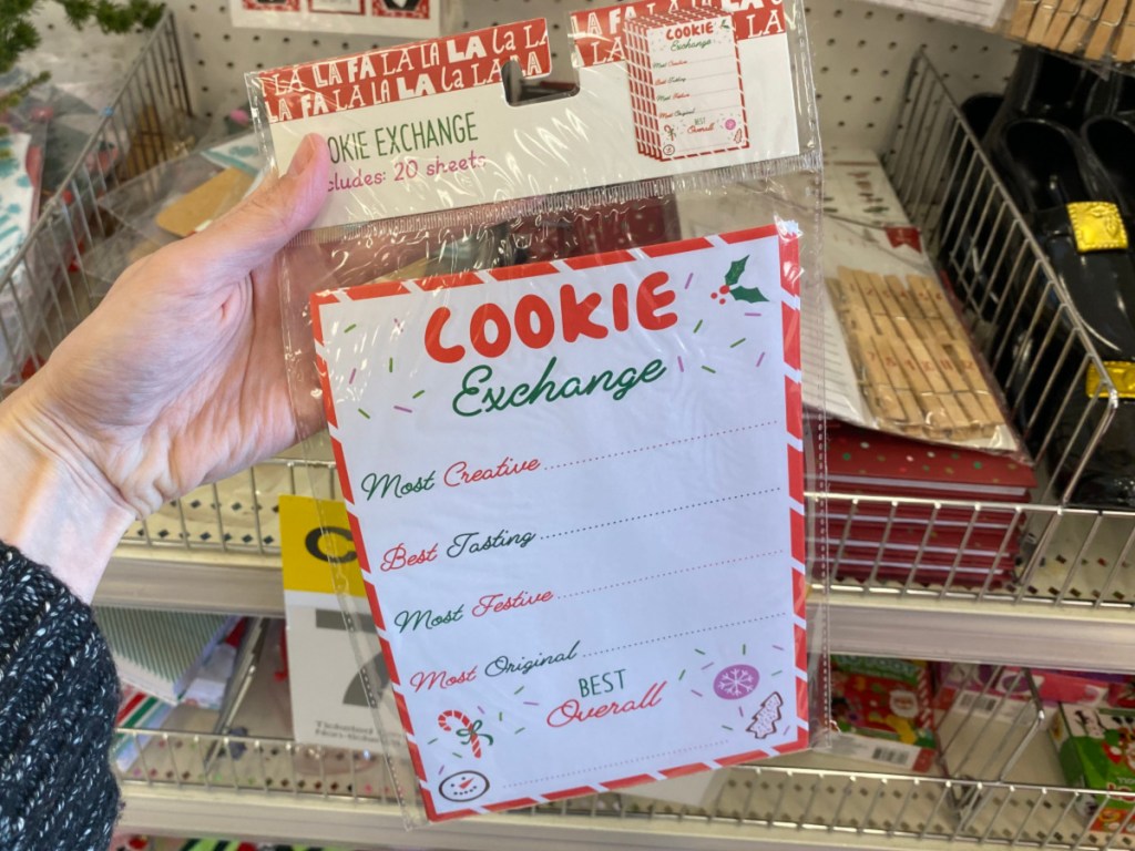 Hand holding Cookie Exchange Sheets at Target 