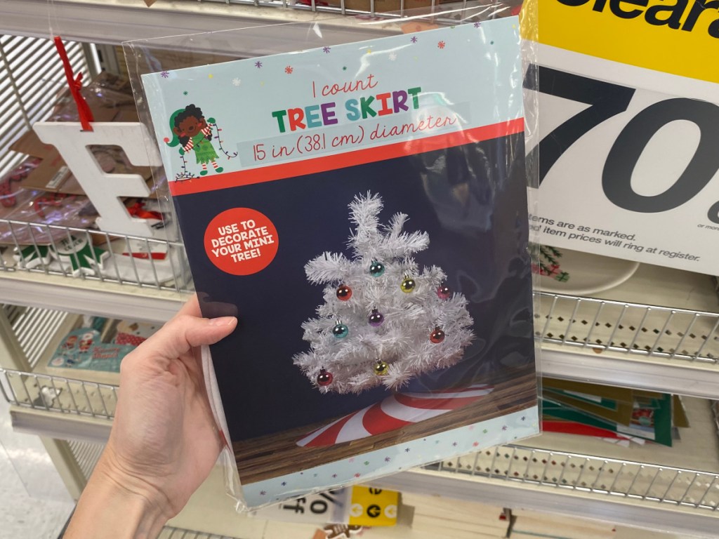 Hand Holding mini Christmas Tree skirt at Target 