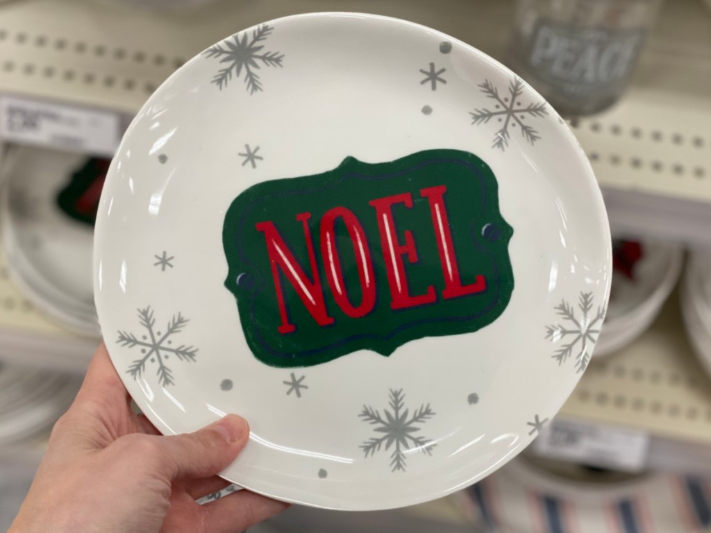 Hand holding holiday plates at Target 