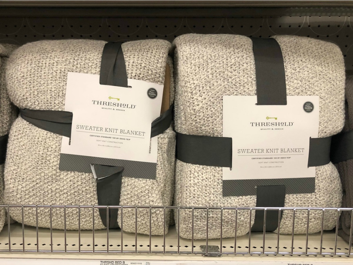 Threshold brand sweater knit blankets in gray color on shelf in-store