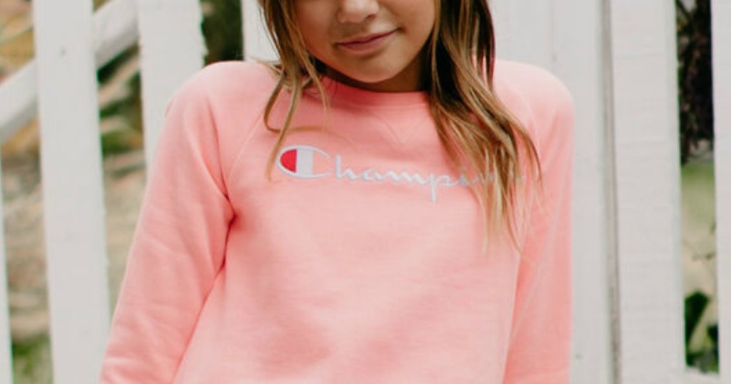Girl wearing pink Champion sweatshirt
