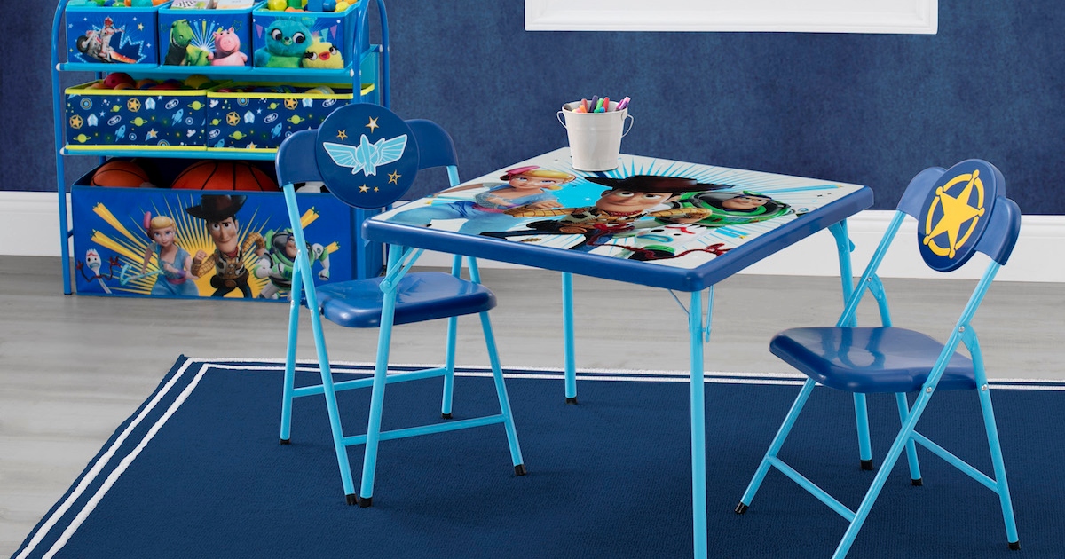 Blue Toy Story Toddler, Table and Chair set. in a room on a blue rug. A Toy story, toy organizer is behind it up against a wall.