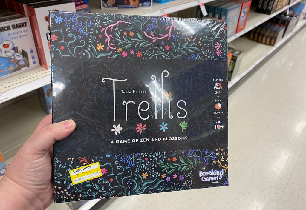 hand holding a Trellis Family Game