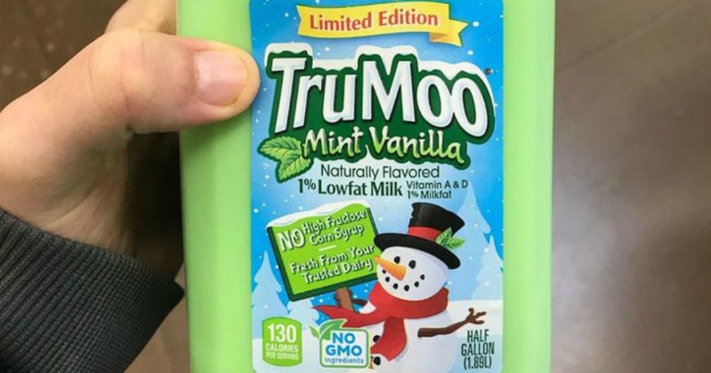 person holding half gallon bottle of TruMoo mint vanilla milk