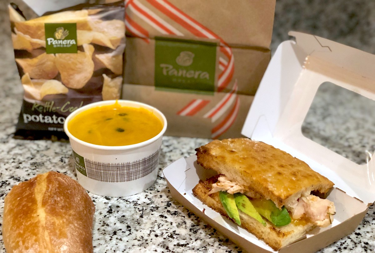 panera food sandwich soup and chips sitting on counter
