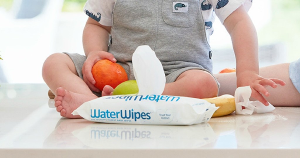 Boy on counter with WaterWipes package