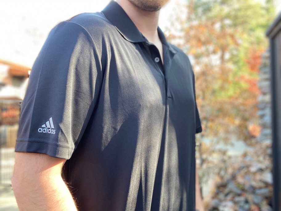 man wearing an adidas polo