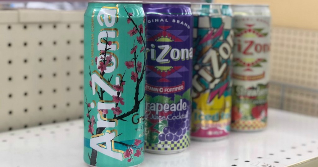 four cans of tea sitting on store shelf