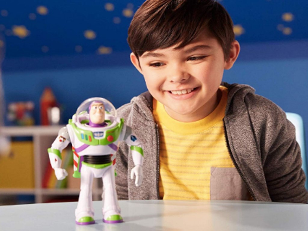 young boy playing with Toy Story GDB92 Disney Pixar Ultimate Walking Buzz Lightyear