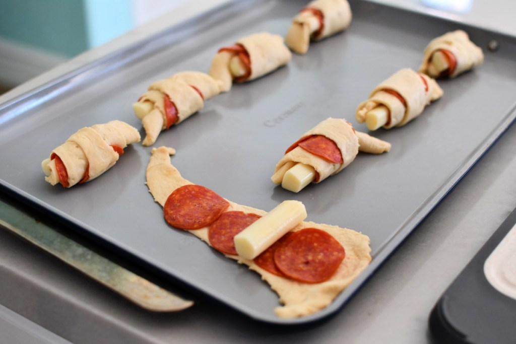 caraway sheet pan with rolled up crescent pizza snacks