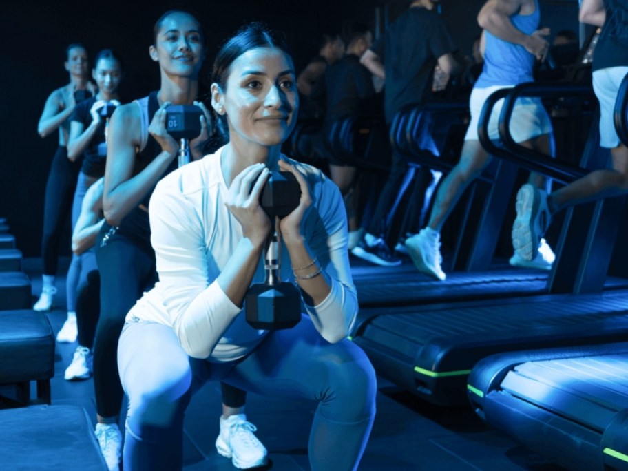 a woman working out with a dumbbell