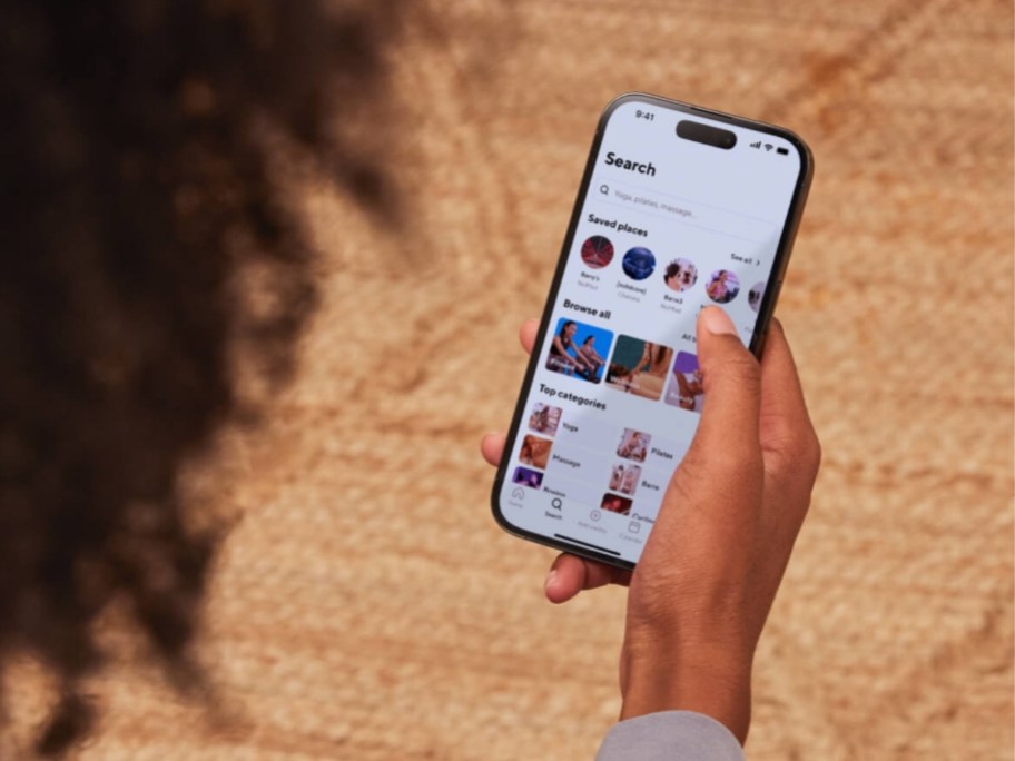 a woman holding a cell phone